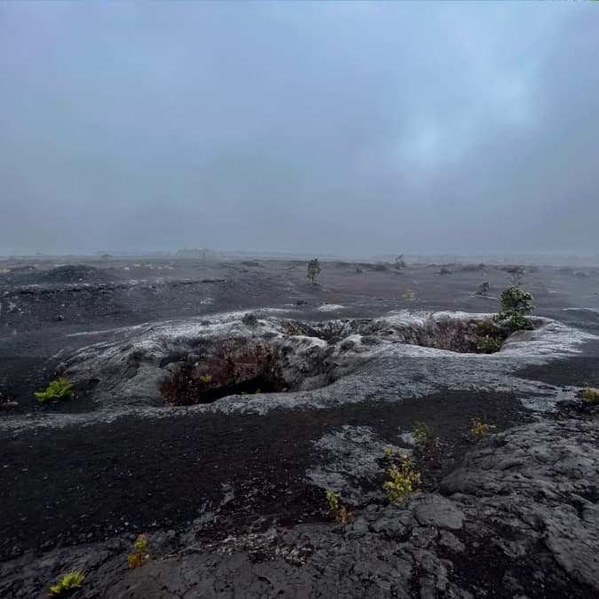 The Mauna Ulu eruption area on Kīlauea, showing hardened lava fields, volcanic vents, and sparse vegetation from historic eruptions.